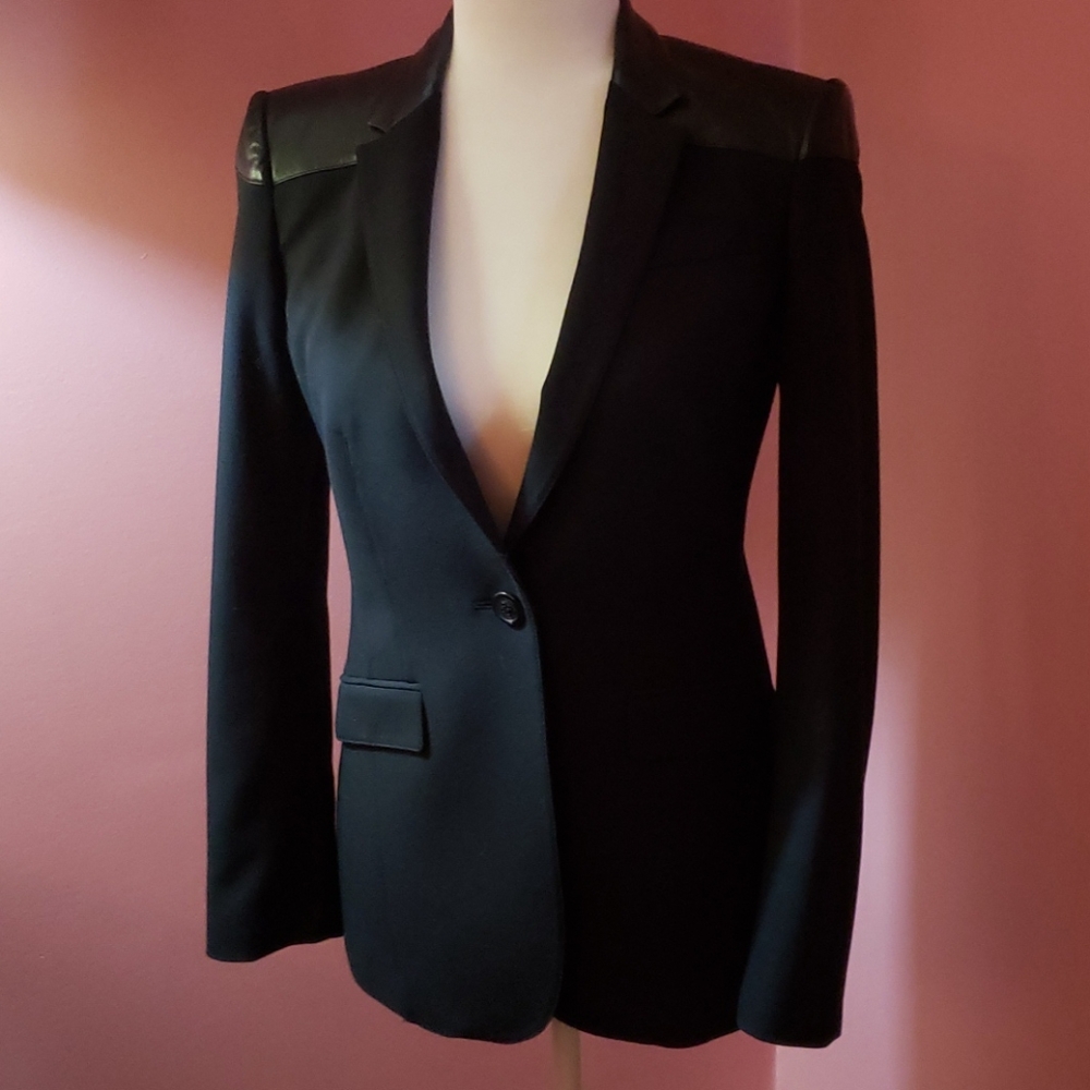 One Burberry jacket with leather trim.